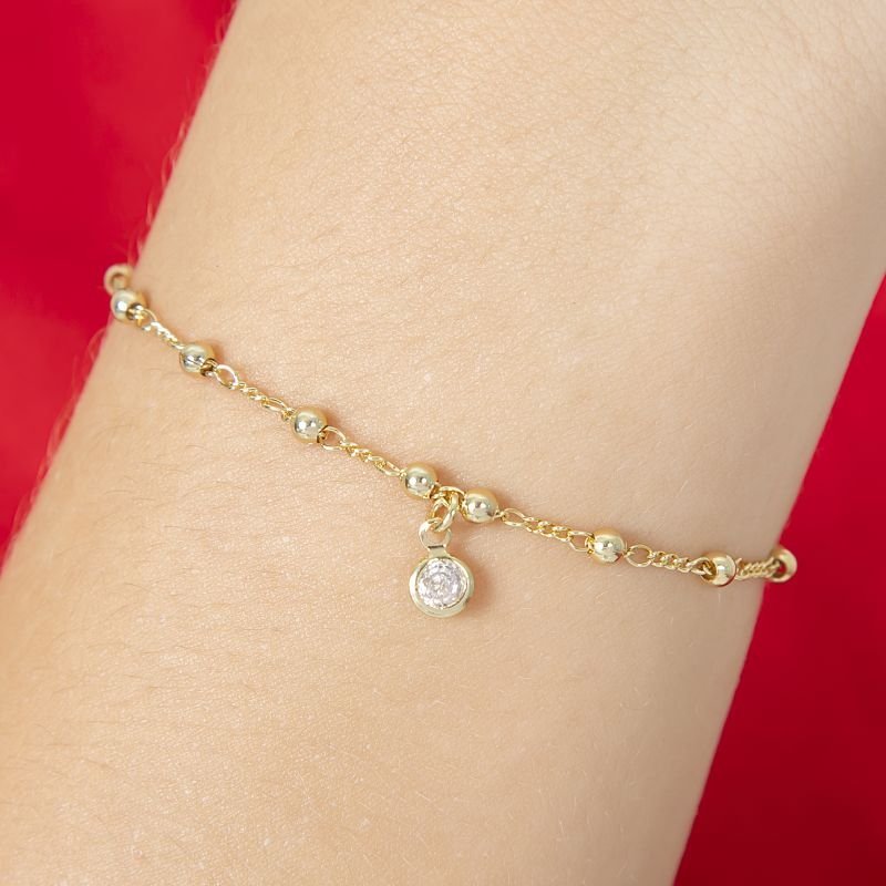 PULSEIRA INFANTIL DE BOLINHAS COM PEDRINHA DE ZIRCONIA PENDURADA