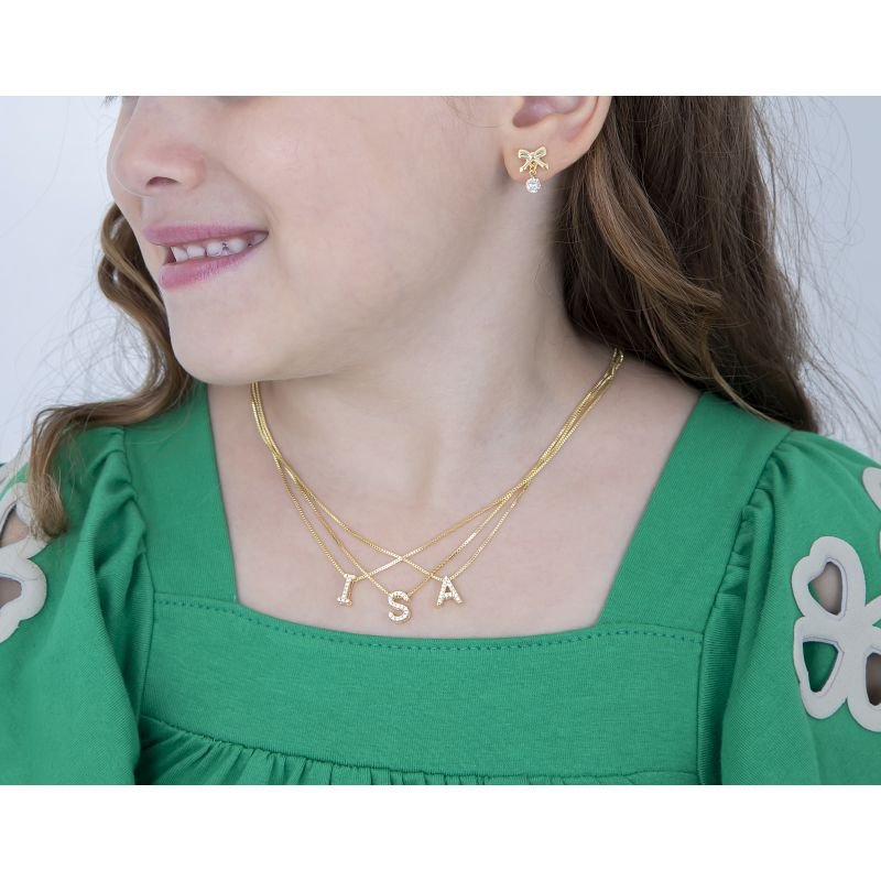 BRINCO INFANTIL LACINHO COM PEDRA CRAVEJADA EM ZIRCÔNIA BANHADO EM OURO